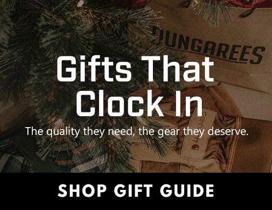 A dungarees shopping bag under a Christmas tree