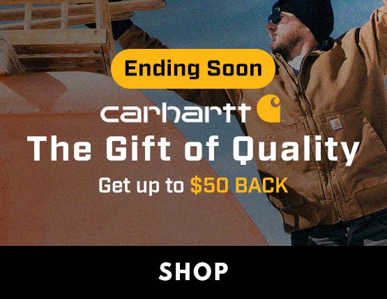 A man wearing Carhartt gear outside in the cold working on a grain bin.