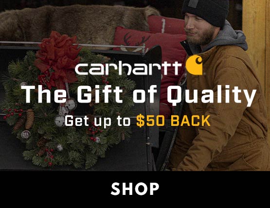Carhartt Gift of Quality Promotion Two men pulling a Christmas sled out of the shed.