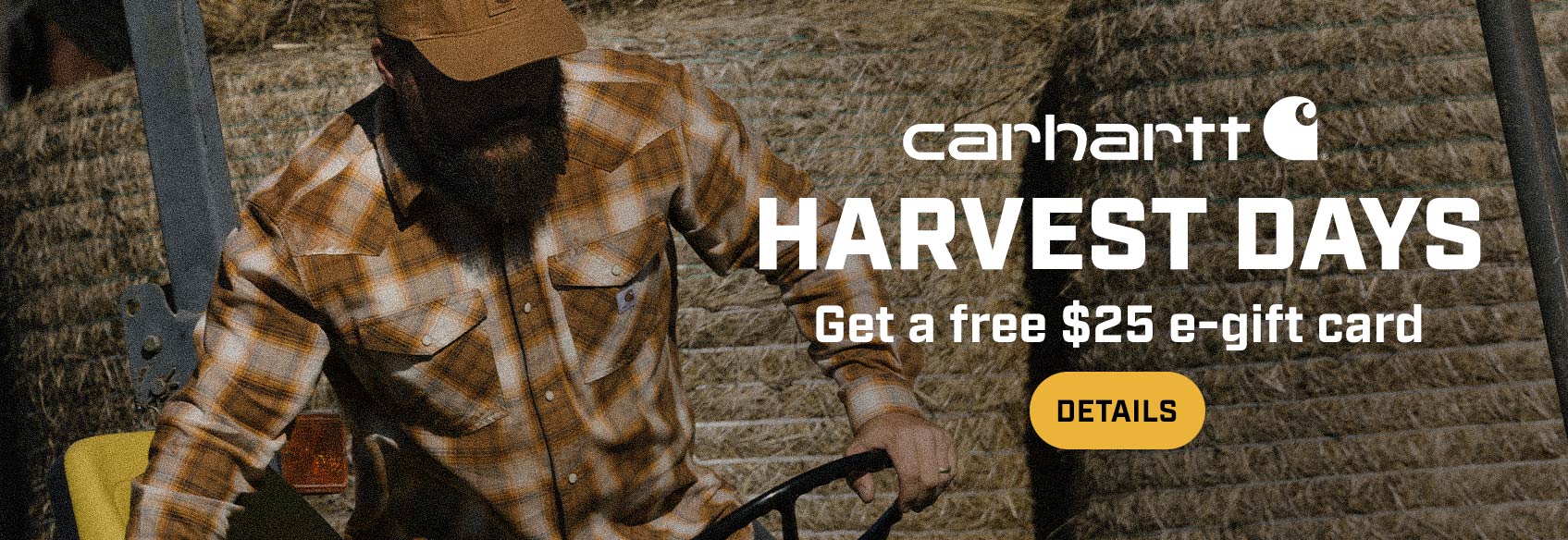 A man working outside in a Carhartt plaid shirt