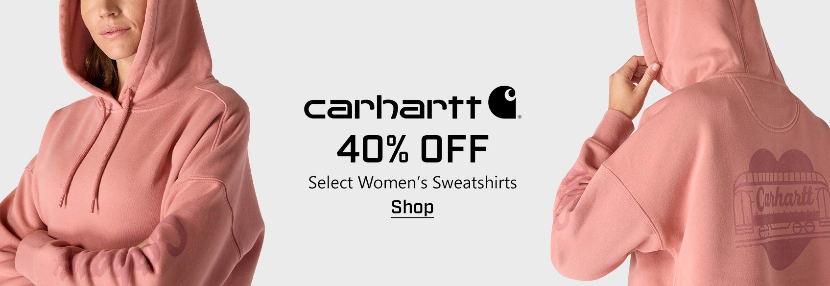 A woman wearing a pink Carhartt sweatshirt