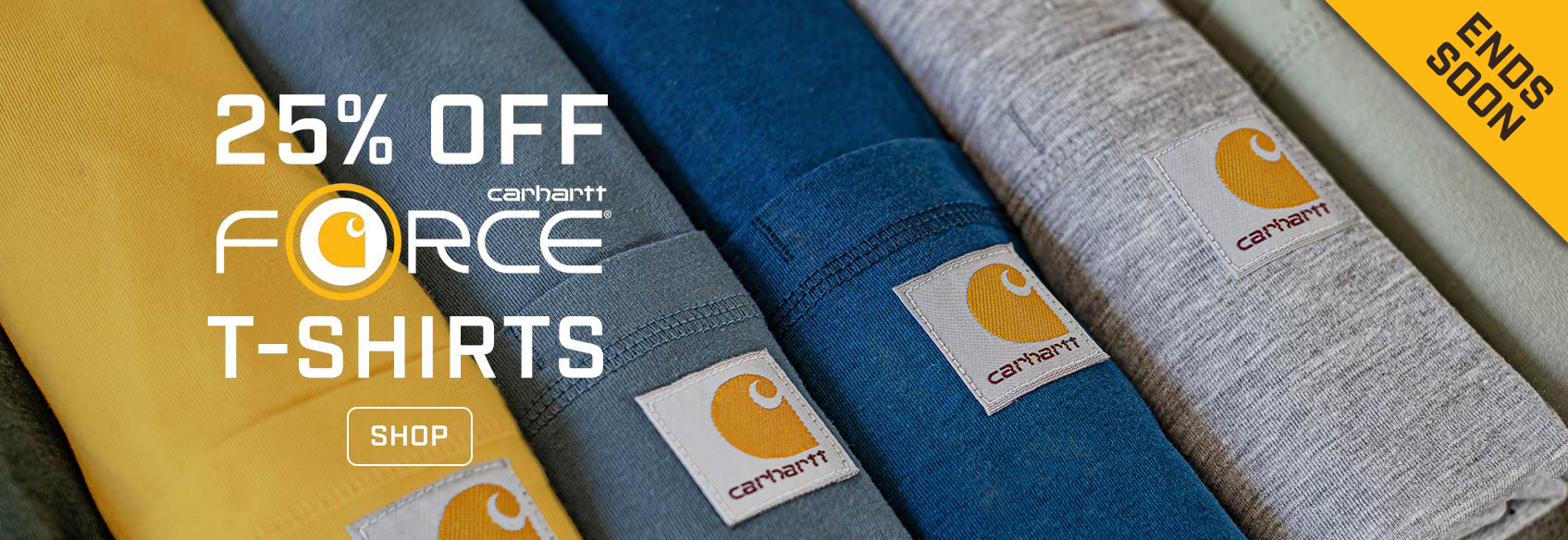 Rolled up Carhartt t-shirts with the Carhartt patch visible. 