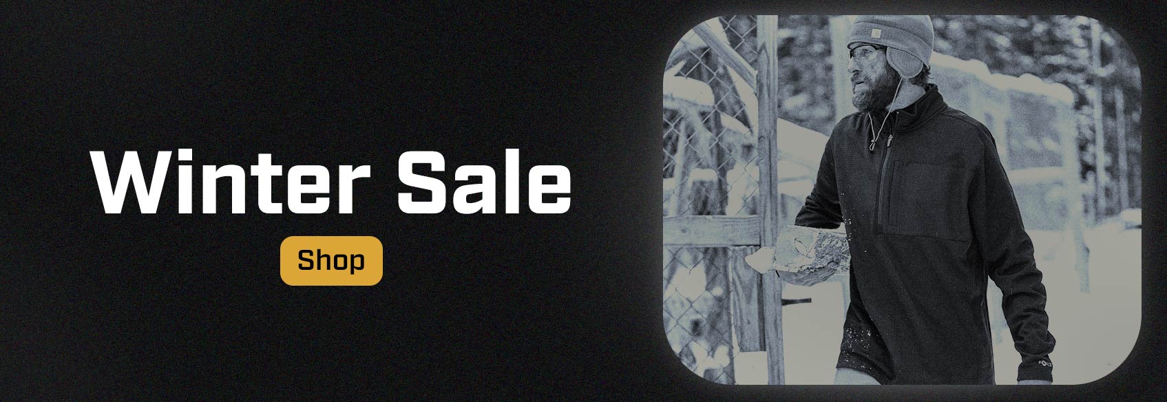 A man wearing a Carhartt sweatshirt in the cold. 