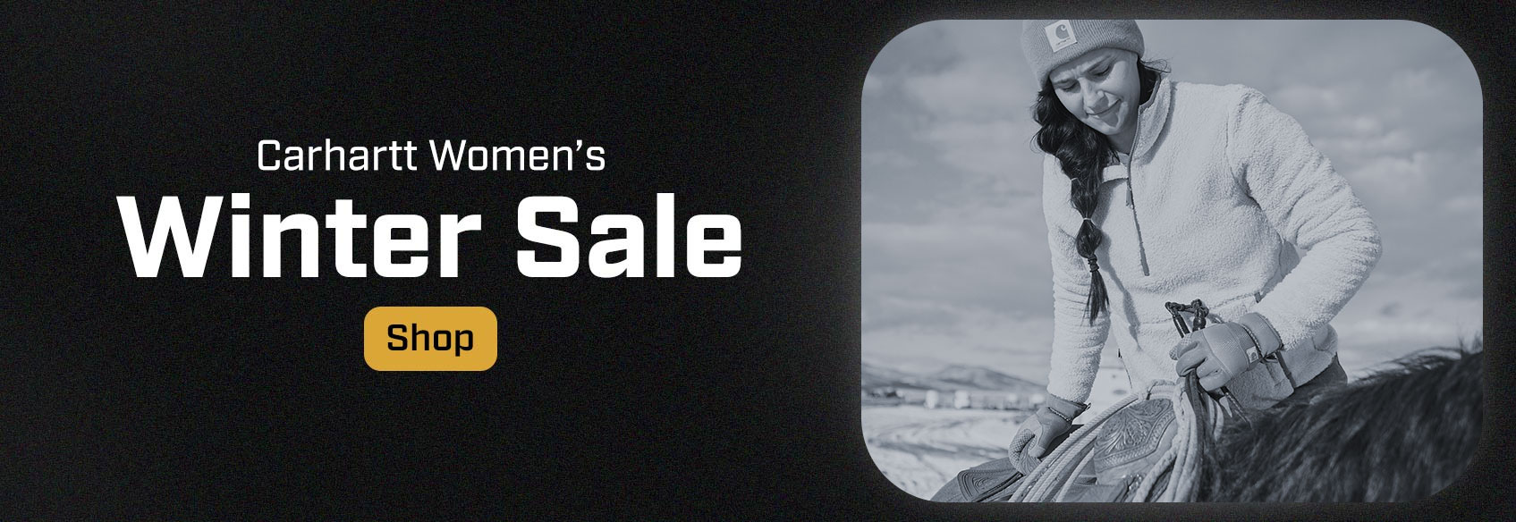 A woman working outside in a Carhartt fleece. 