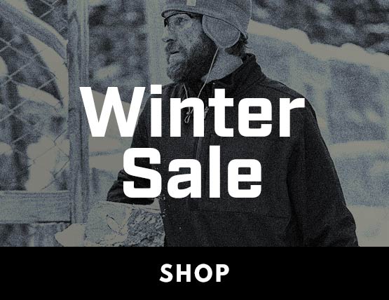 A man wearing a Carhartt sweatshirt in the cold. 