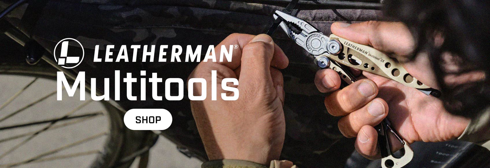 Leatherman Multitools A closeup of a man's hands adjusting a zip tie with a brown Leatherman multitool