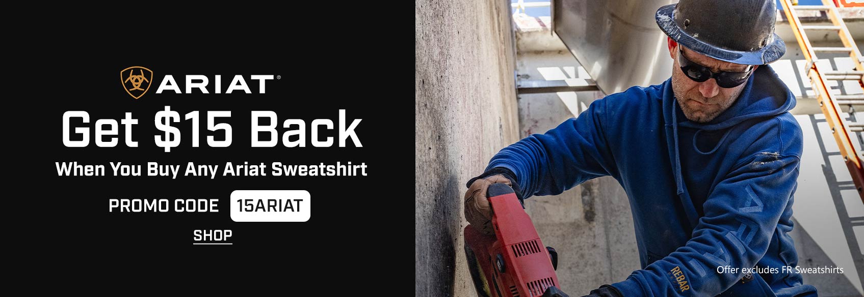 A construction worker wearing a hard hat and a blue Ariat hoodie. 