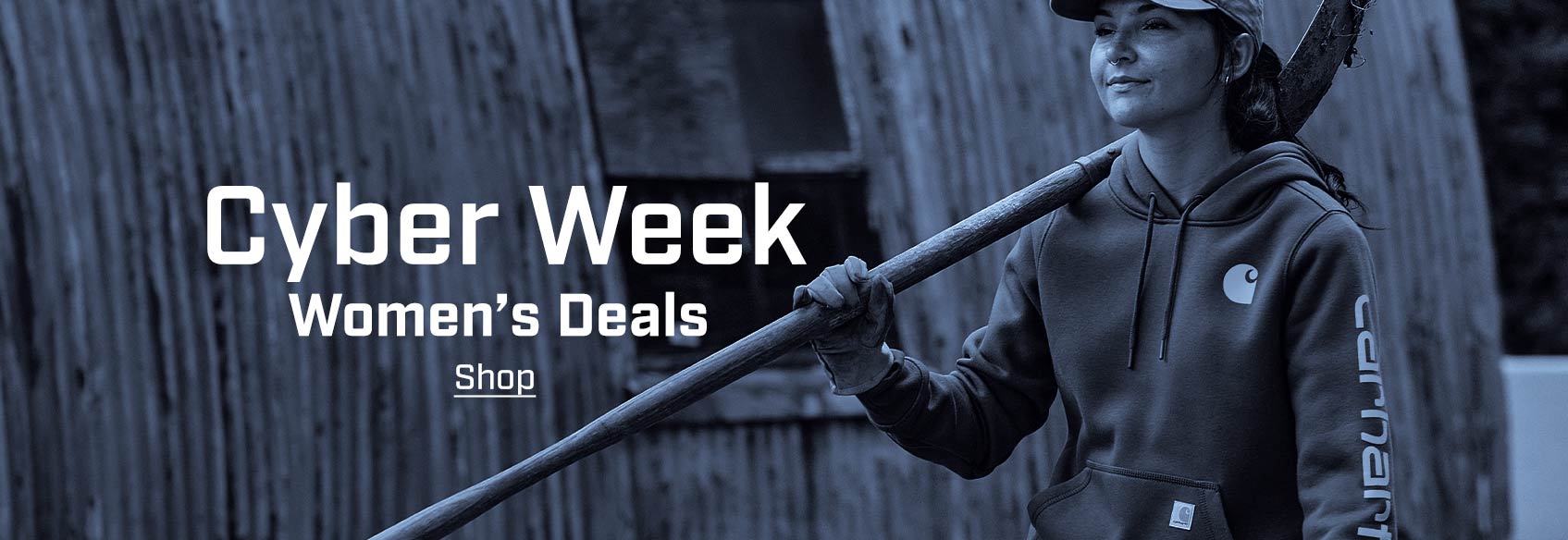 a woman working on a farm in a Carhartt hoodie