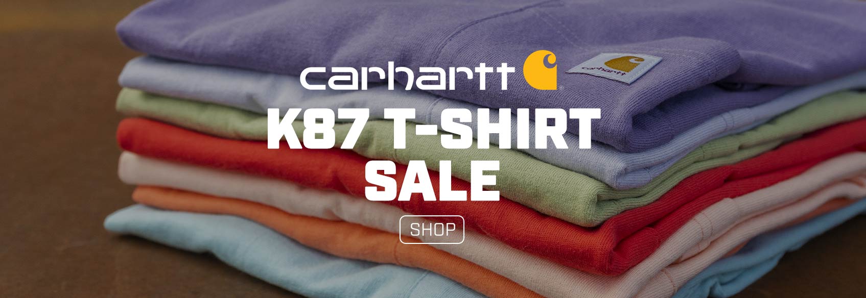 A stack of folded women't Carhartt pocket t-shirts. 