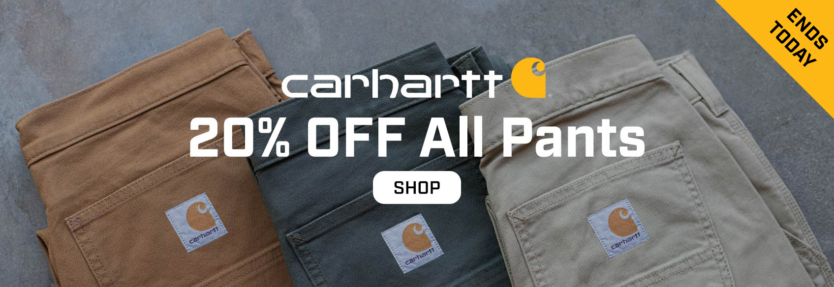 3 Carhartt pants laying on the ground - sale ends today