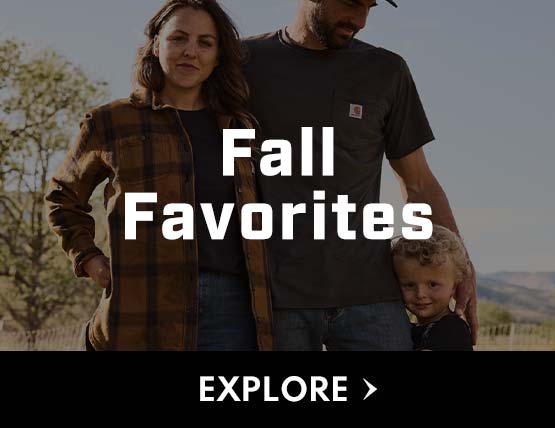 A family outside in the fall wearing carhartt clothing