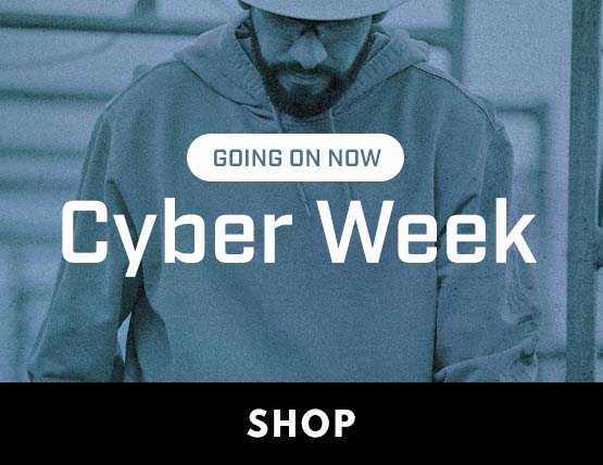 Cyber Week Deals A man working in the cold wearing a Carhartt hoodie and hard hata