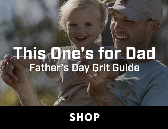 A man and his child smiling. 