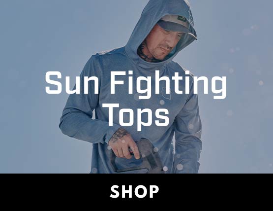 A man working outside in the sun wearing a light blue hooded t-shirt.