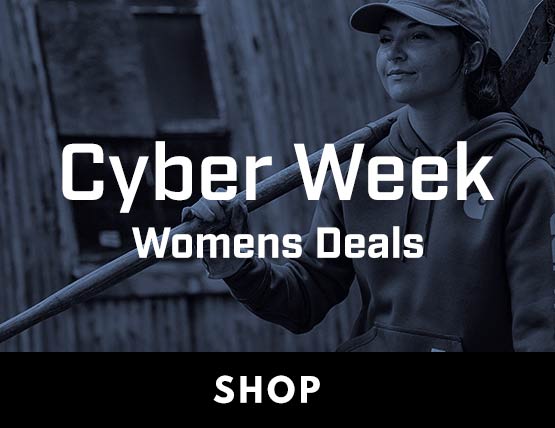 a woman working on a farm in a Carhartt hoodie