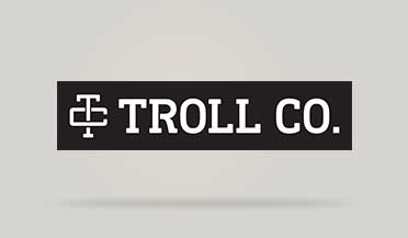 Troll Co. on a black button