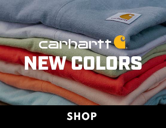 Multiple new Carhartt t-shirts in various spring colors folded and stacked.